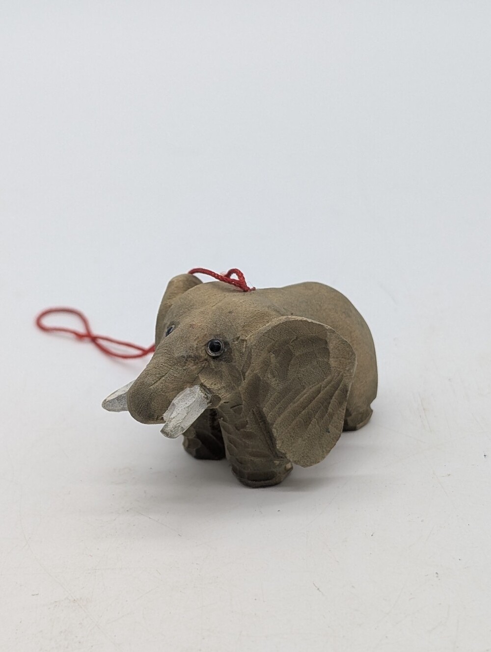 Vintage Hand-Carved Wooden Elephant Ornament in Brown with White Tusks